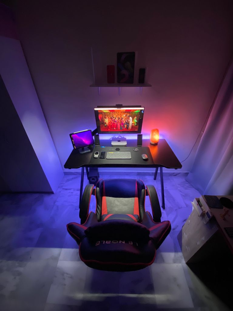A colorful gaming desk setup with LED lights in Kuala Lumpur.