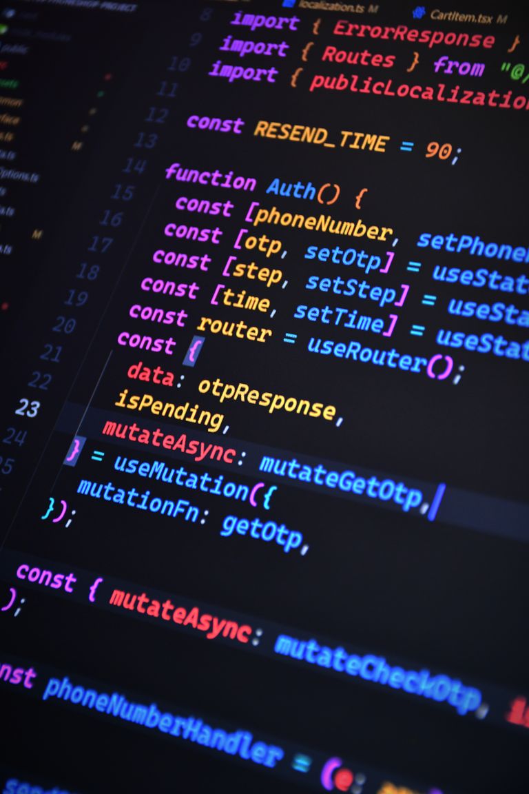 Close-up of vibrant JavaScript code for web development with ReactJS and Tailwind CSS.