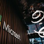 Interior view of Microsoft office with logo on wooden wall in Brussels, Belgium.